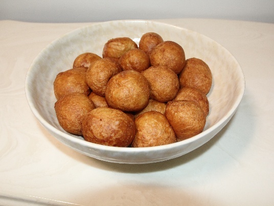Beignet served in a white bowl